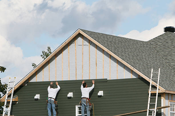 Professional Vinyl Siding technician working in Seville, FL